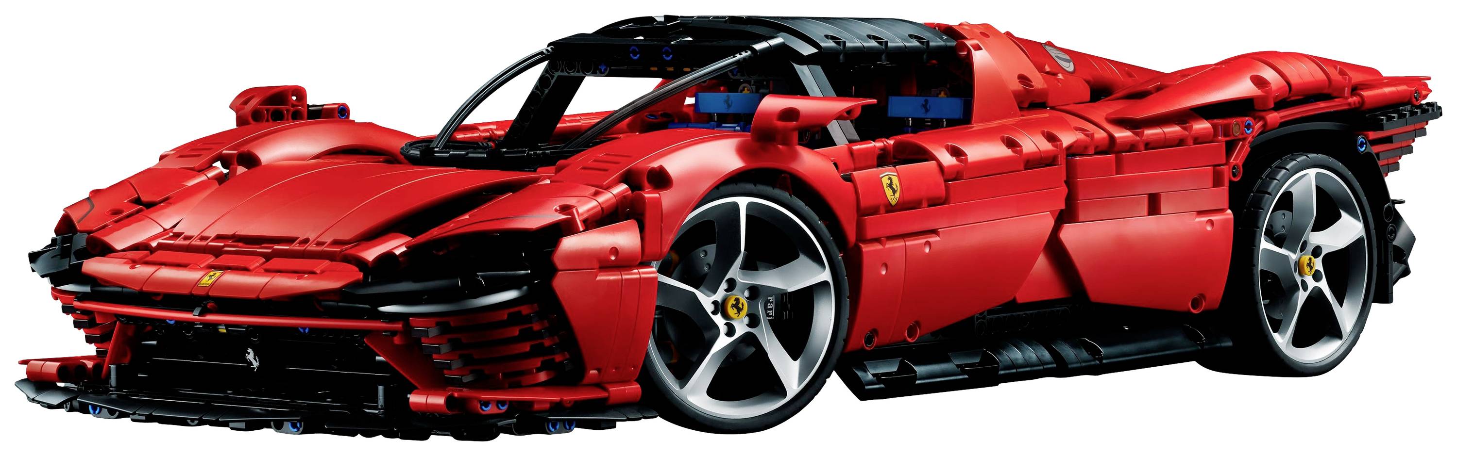 Červené modelové auto, inspirované sportovním vozem, s detailními prvky jako jsou aerodynamické tvary a velká kola.