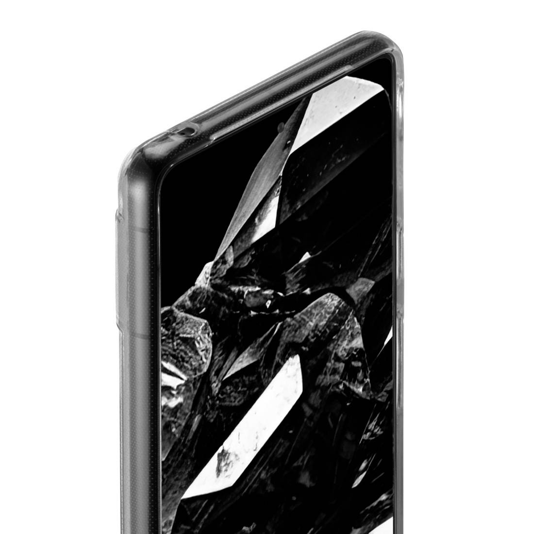 Smartphone s černým geometrickým vzorem na obrazovce, pohled z boku.