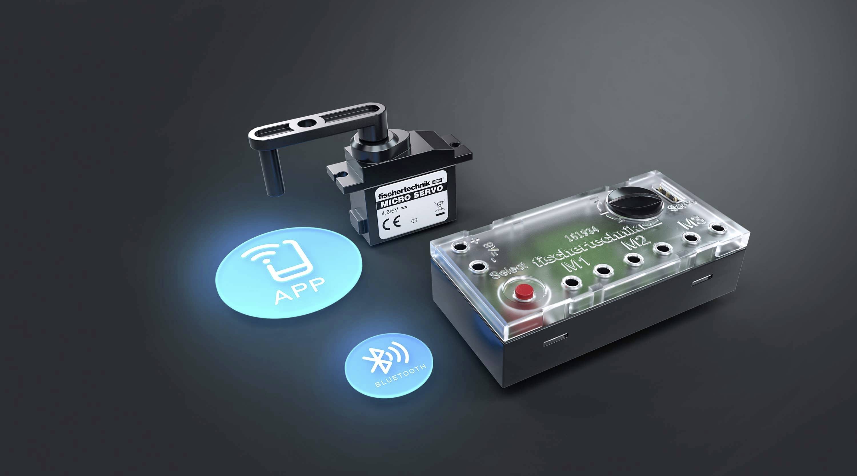 Na obrázku je elektrické řídicí zařízení s přepínači a indikátory, vedle něj jsou dvě kulaté ikony symbolizující konektivitu aplikace a Bluetooth.