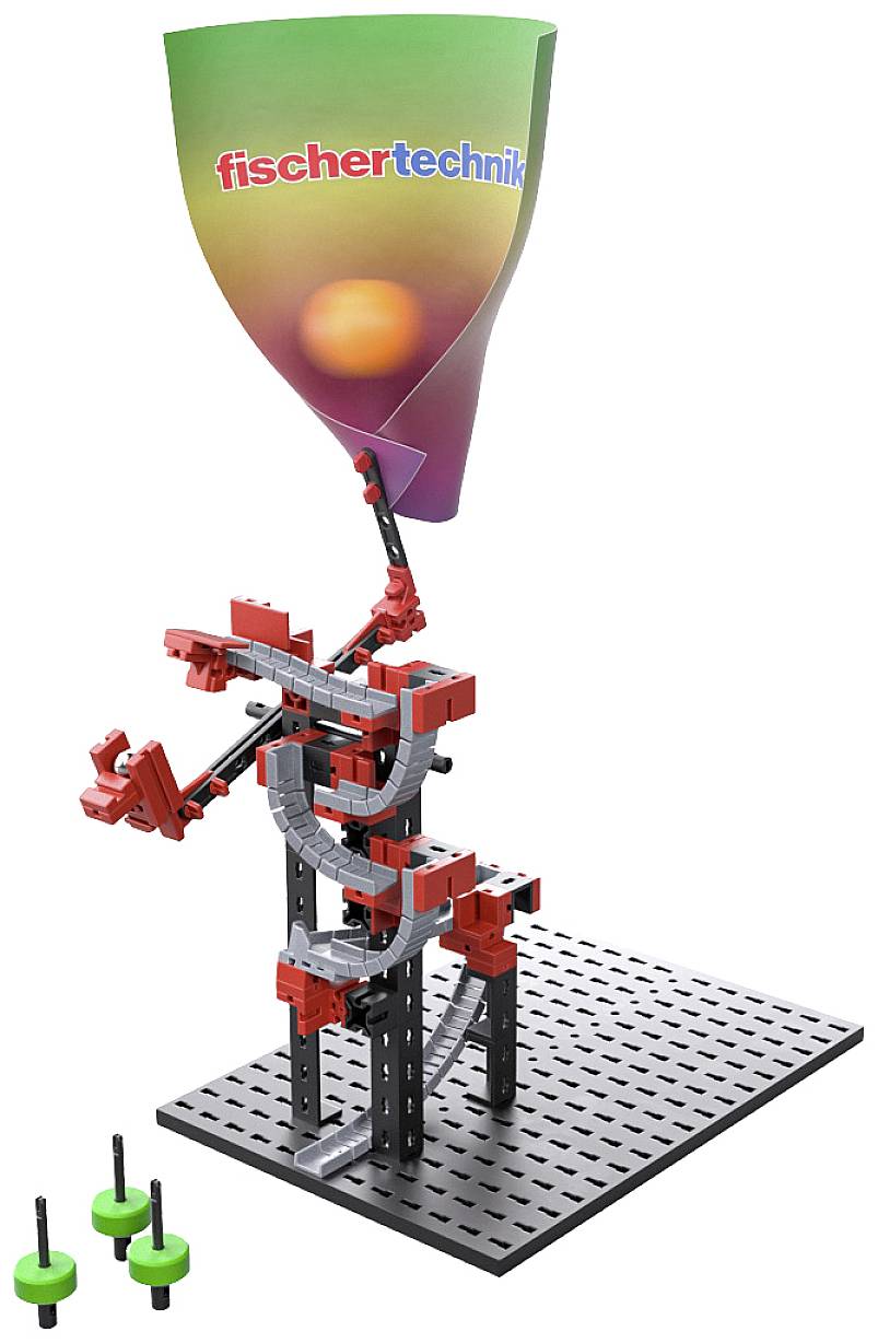 Průmyslový modelářský stavebnicový set z červených a šedých dílů na černé základně, s logem 'fischertechnik' na barevné cedulce.