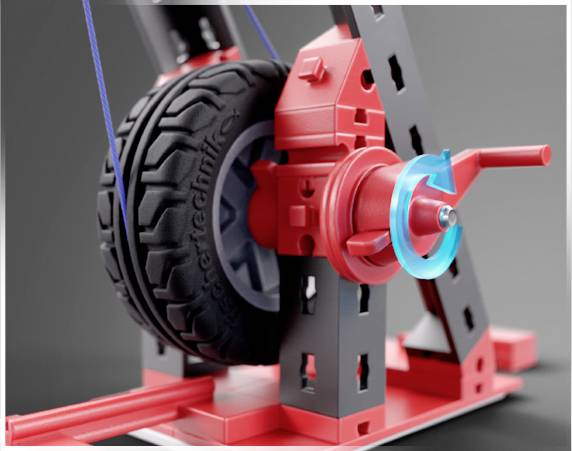 Hračkový jeřáb z Lego Techniku s klikovým mechanismem pro zvedání černého kola. Zaměření na kliku a kolo.