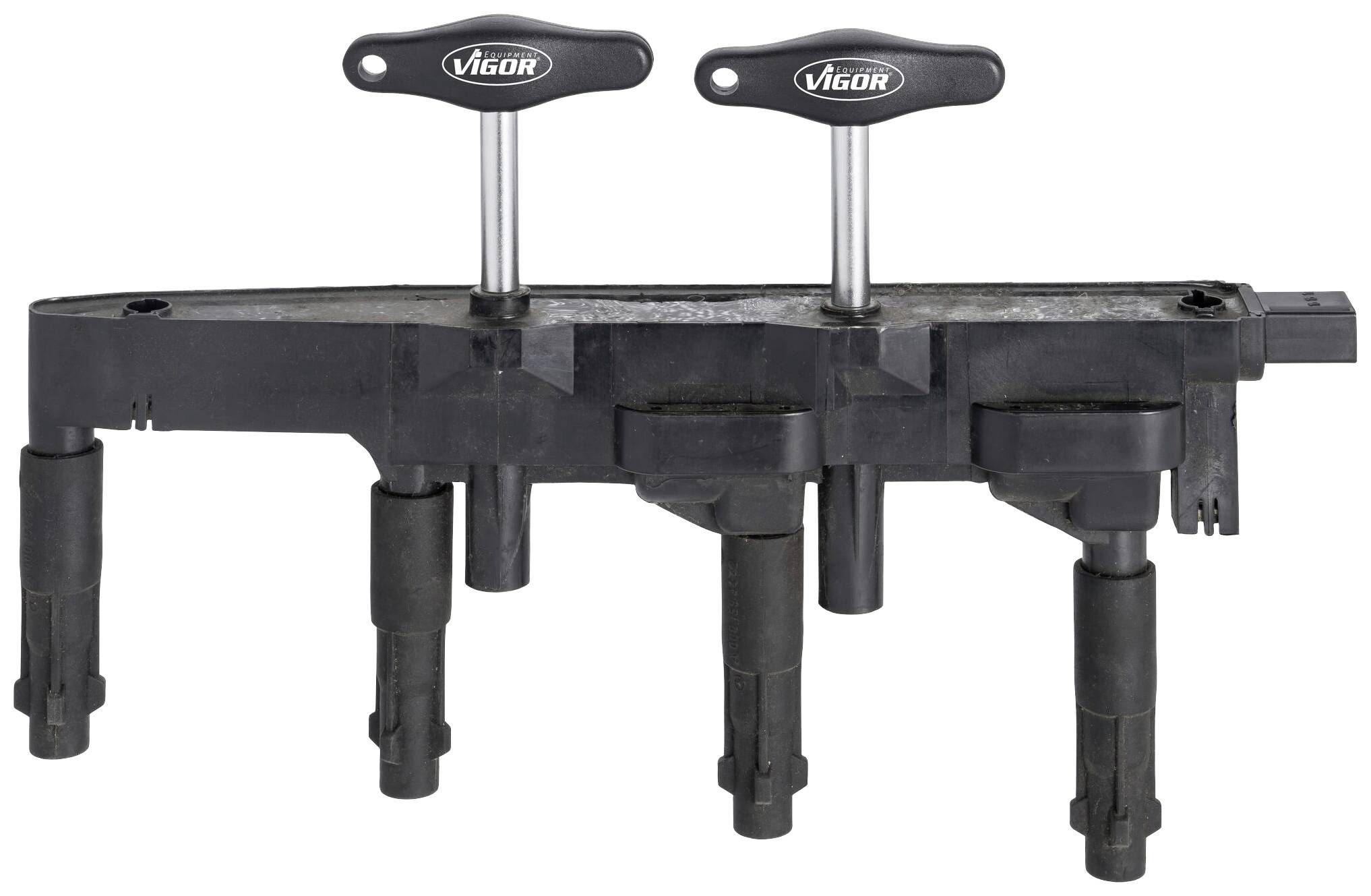 Černý seřizovací nástroj ventilů motoru se čtyřmi kolíky a dvěma rukojeti, označený značkou 'Vigor', určený pro nastavení ventilů motoru.