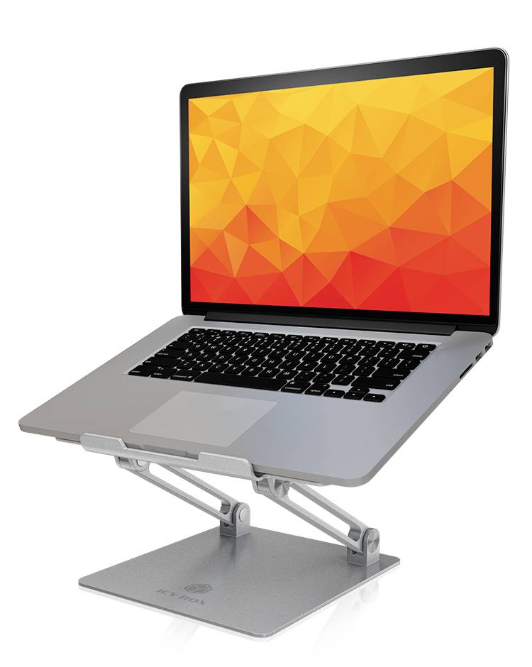Notebook leží na nastavitelném stříbrném stojanu. Obrazovka zobrazuje geometrický oranžový vzor.