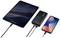 Tablet, powerbanka a smartphone jsou propojeny kabely. Smartphone ukazuje, že se nabíjí.