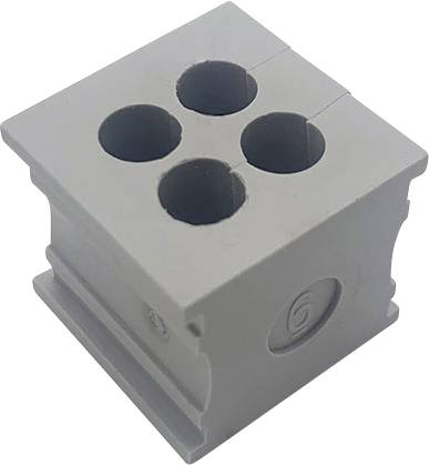 Šedý plastový díl se čtyřmi kulatými prohlubněmi, podobný konektoru nebo připojovací desce.