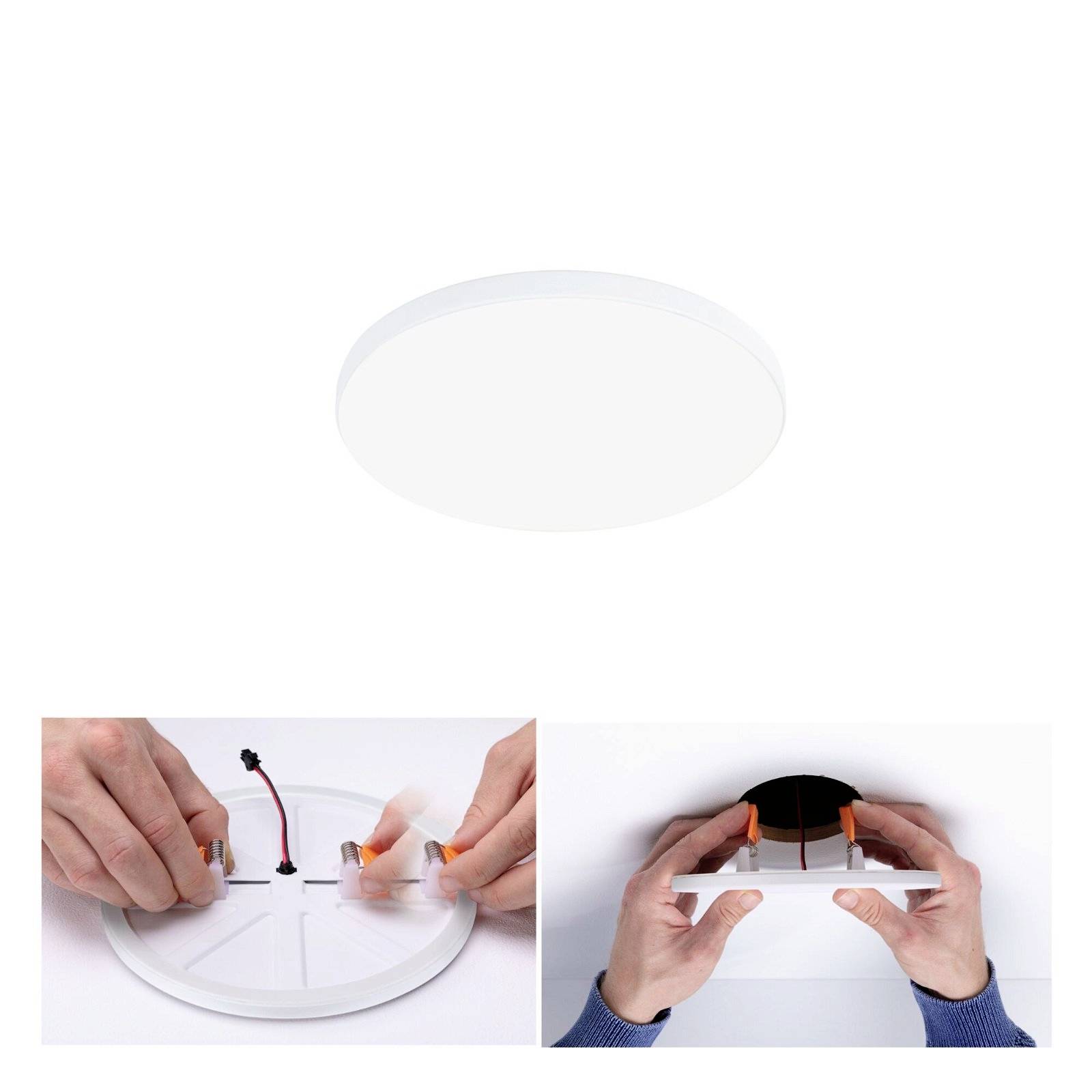Kulatá LED stropní lampa je montována. Vlevo jsou připojovány kabely, vpravo je lampa přitlačována ke stropu.