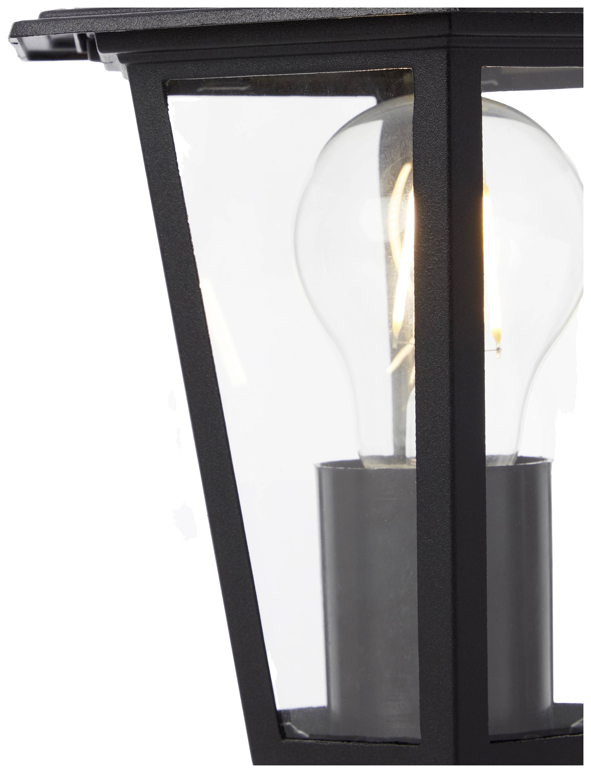 Venkovní osvětlení s černým rámem a sklem, uvnitř kterého je viditelná rozsvícená žárovka.