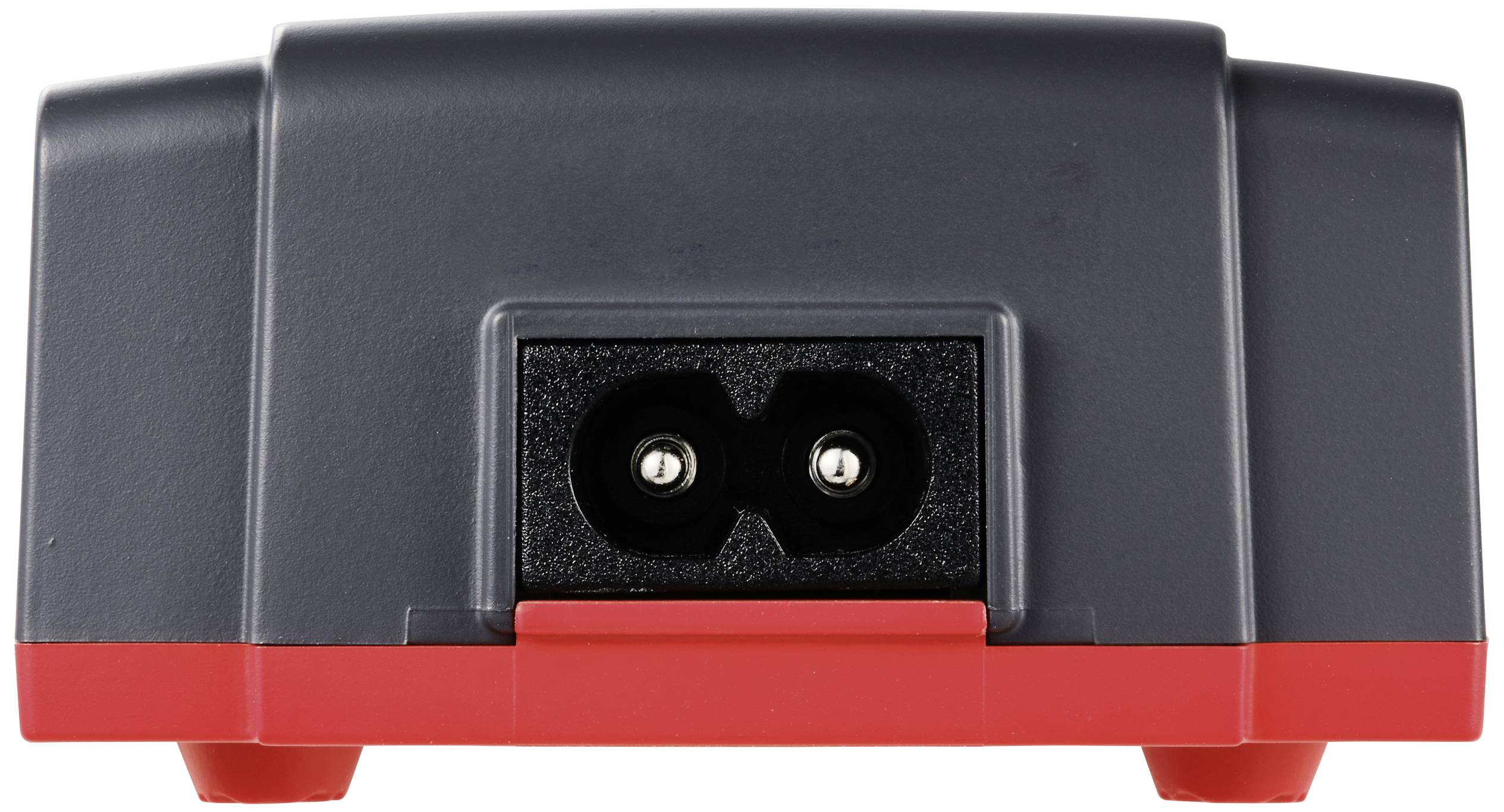Černé elektronické zařízení s dvoupólovou zásuvkou na zadní straně, obklopené červeným podstavcem.