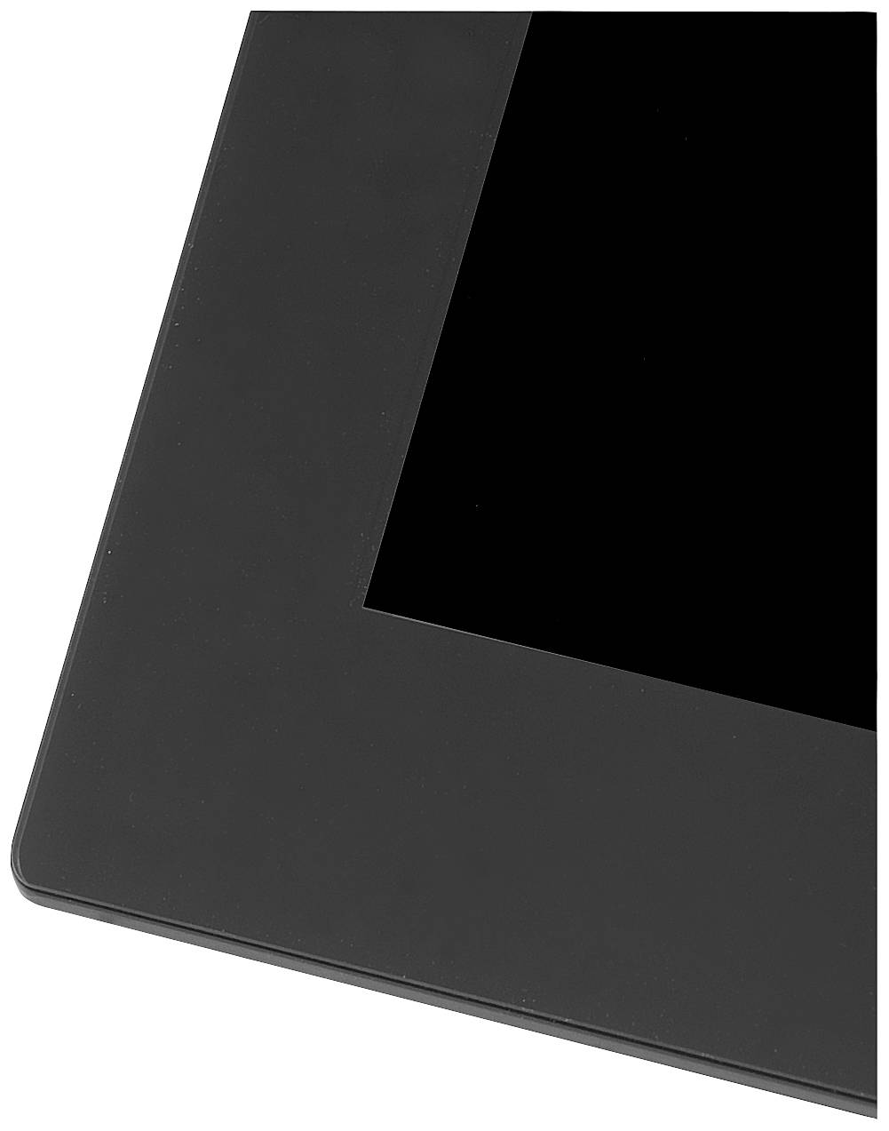 Černé obdélníkové zařízení, pravděpodobně tablet nebo monitor, je částečně viditelné s černou obrazovkou.
