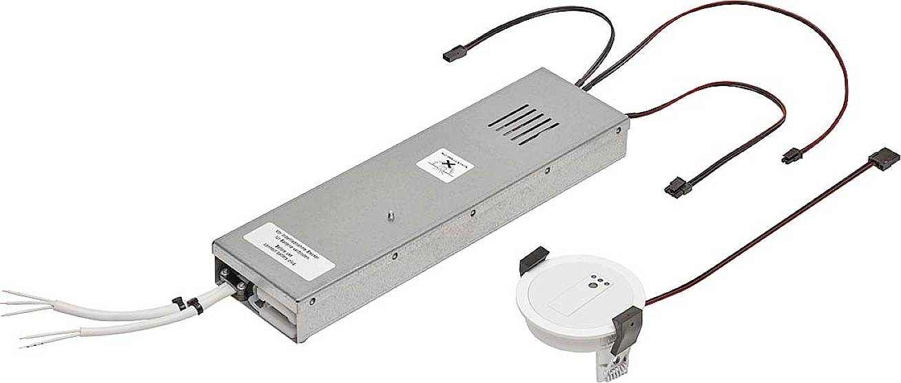 Elektronické zařízení s obdélníkovým kovovým pouzdrem, několika kabely a samostatnou kruhovou komponentou. Používá se v technických aplikacích.