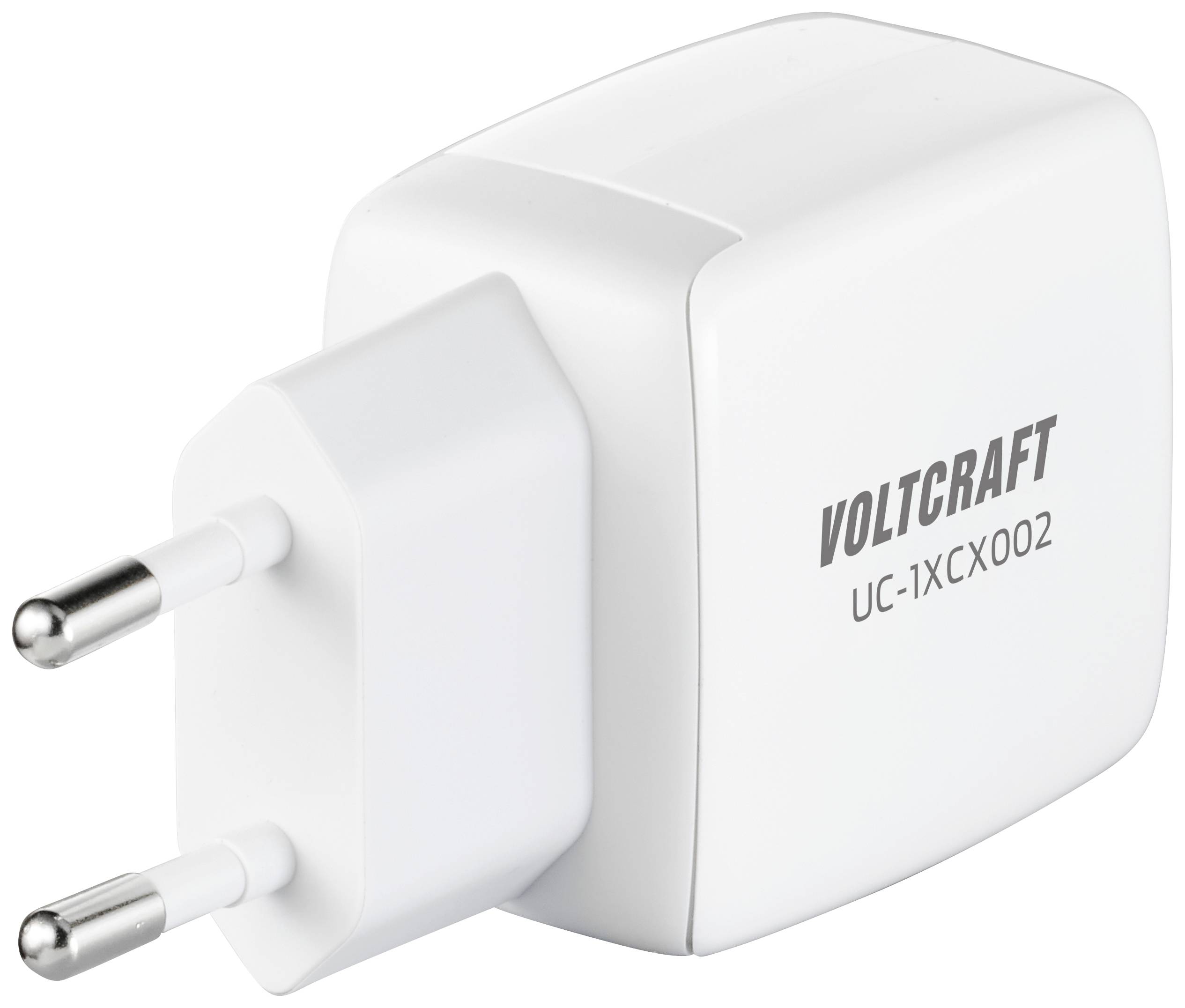 Bílá nabíječka s evropskou zástrčkou. Na straně je vytištěna značka 'Voltcraft' a model 'UC-1XCX002'.