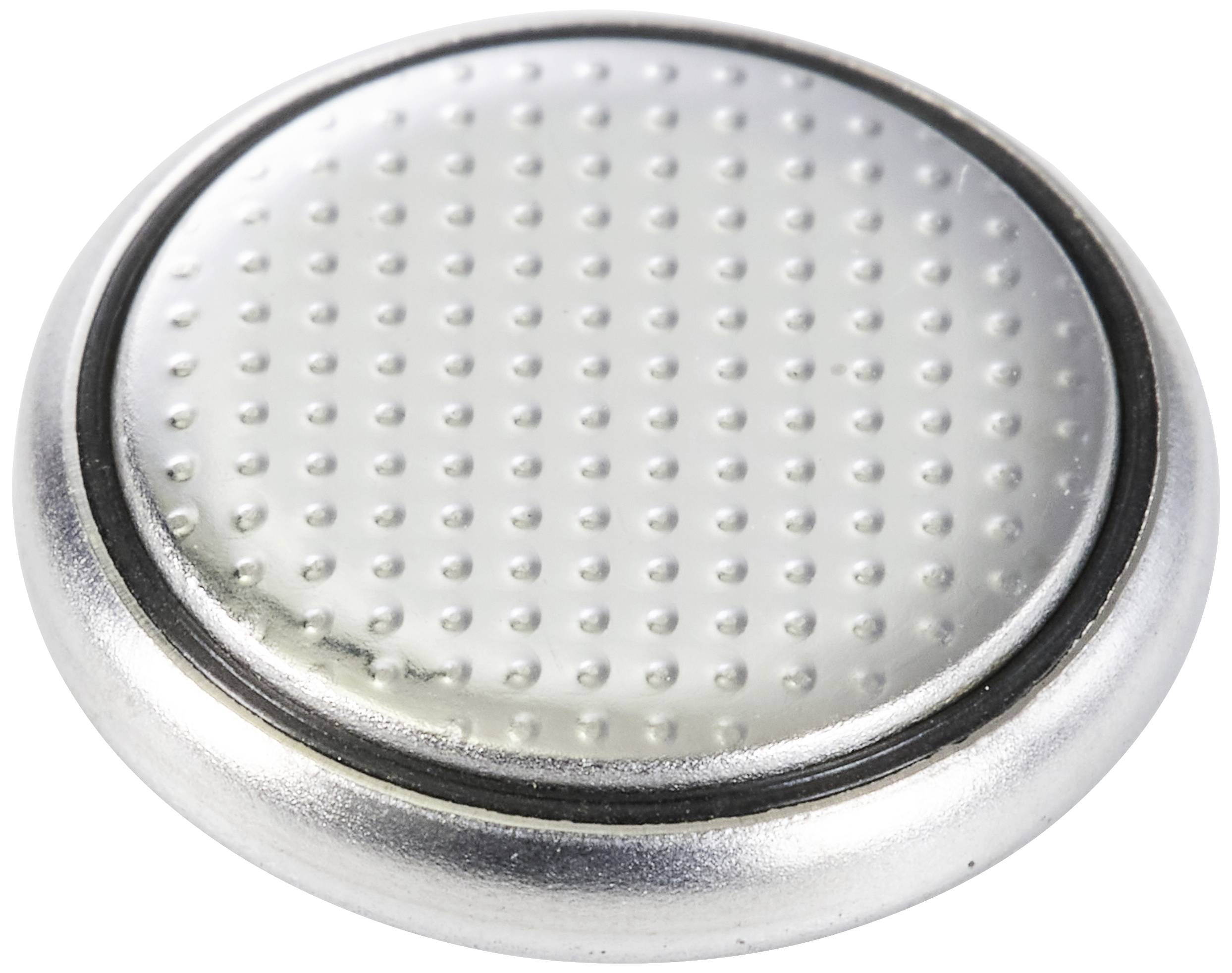 Stříbrná knoflíková baterie s tečkovaným povrchem.