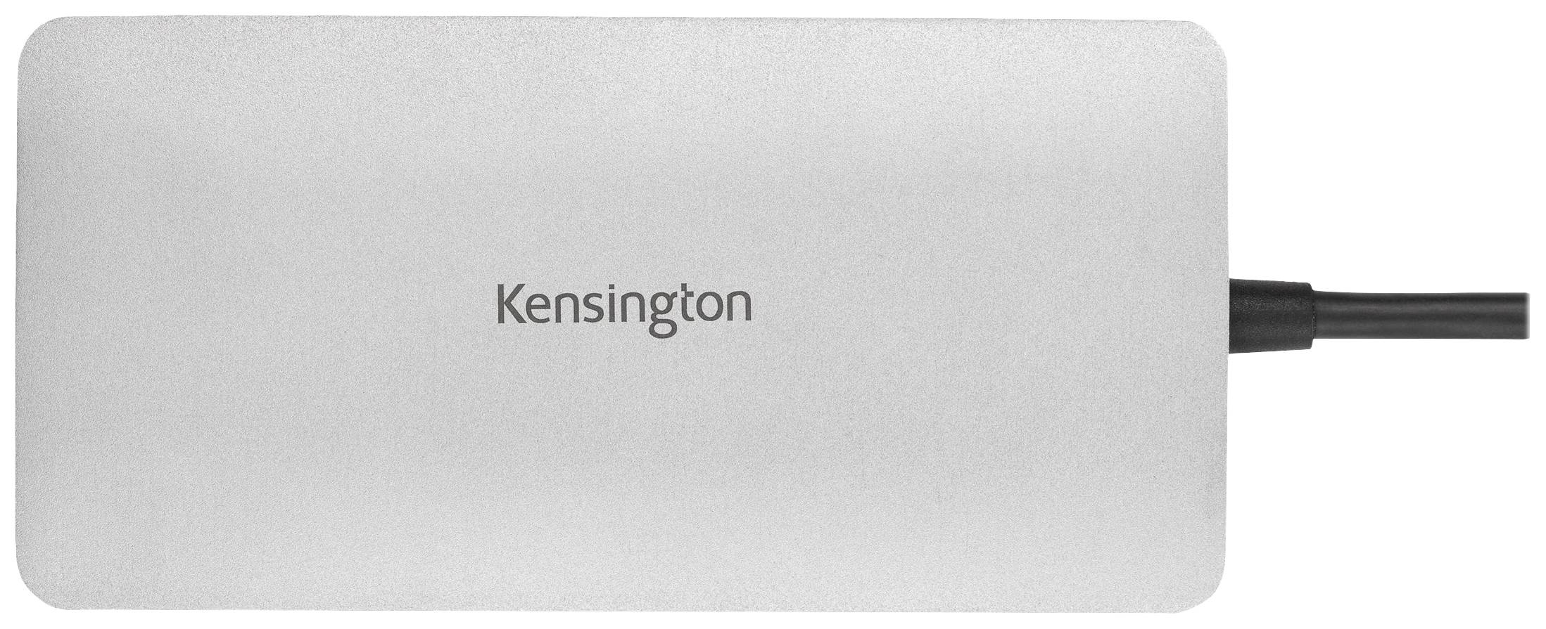 Stříbrné zařízení Kensington s kabelovým připojením, pravděpodobně externí pevný disk nebo elektronické příslušenství.