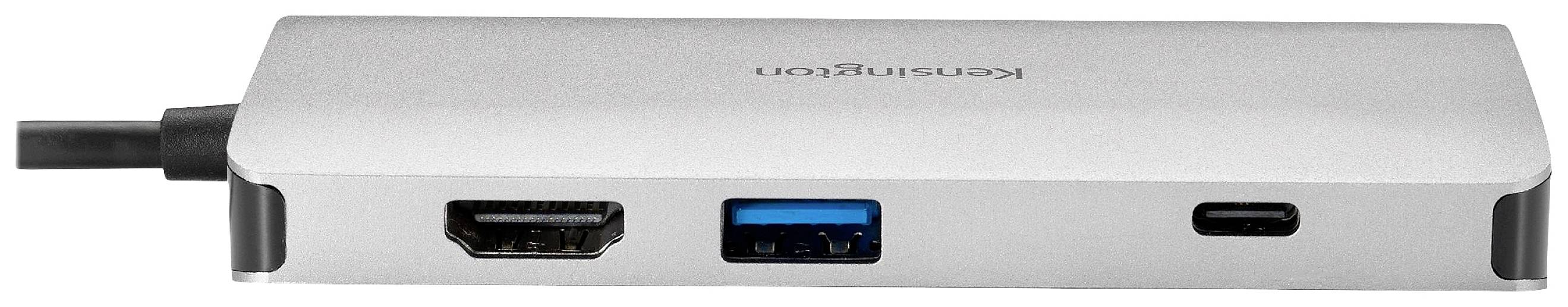 Stříbrný adaptér značky Kensington s rozhraními HDMI, USB a USB-C. Vhodný pro připojení několika zařízení.