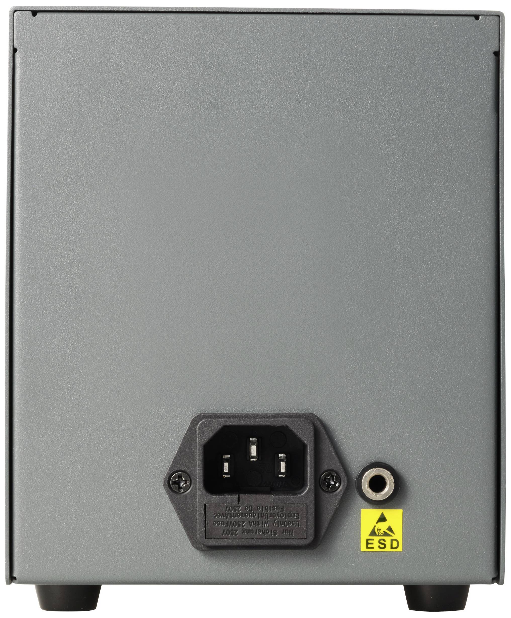 Zadní strana elektronického zařízení s přívodním síťovým kabelem připojeným uprostřed dole a žlutou výstražnou značkou ESD (elektrostatického výboje) vedle něj.