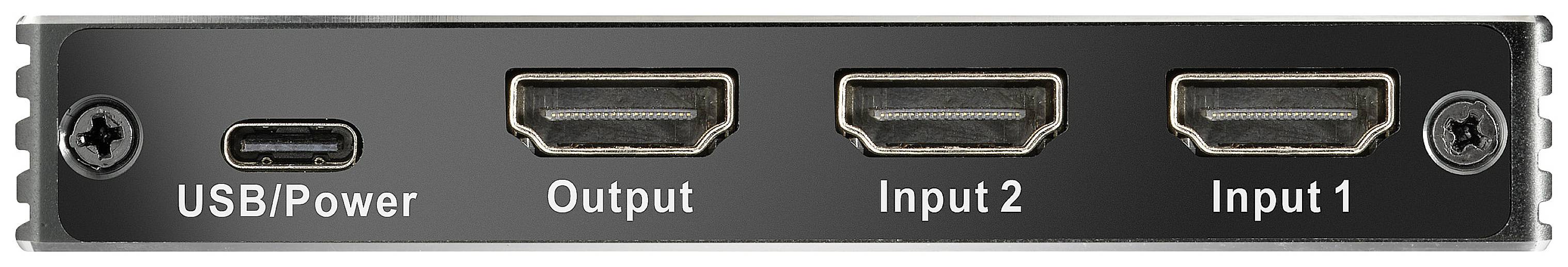 Černé zařízení s přípoji: vlevo port 'USB/Power', vpravo dva HDMI vstupy označené jako 'Input 2' a 'Input 1'.