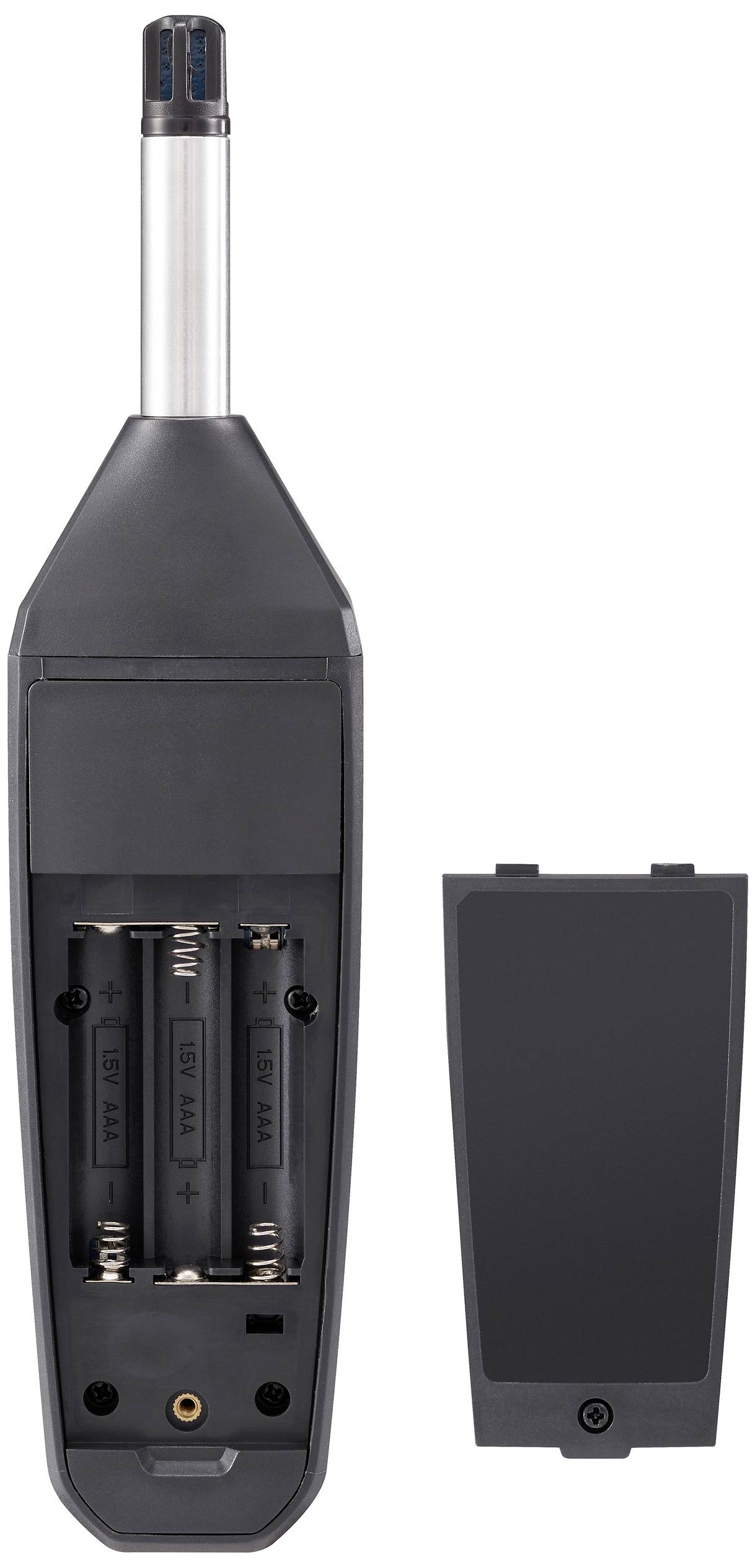 Otevřené tmavé elektronické zařízení zobrazuje prostor pro dvě baterie AA, vedle něj leží sejmuté víko.