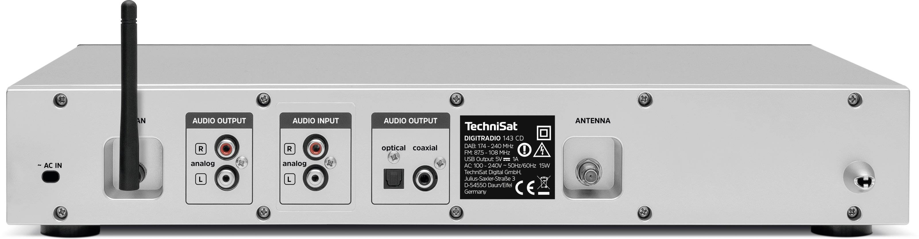 Zadní pohled na stříbrný audiopřijímač s různými audio vstupy a výstupy a připojenou anténou.