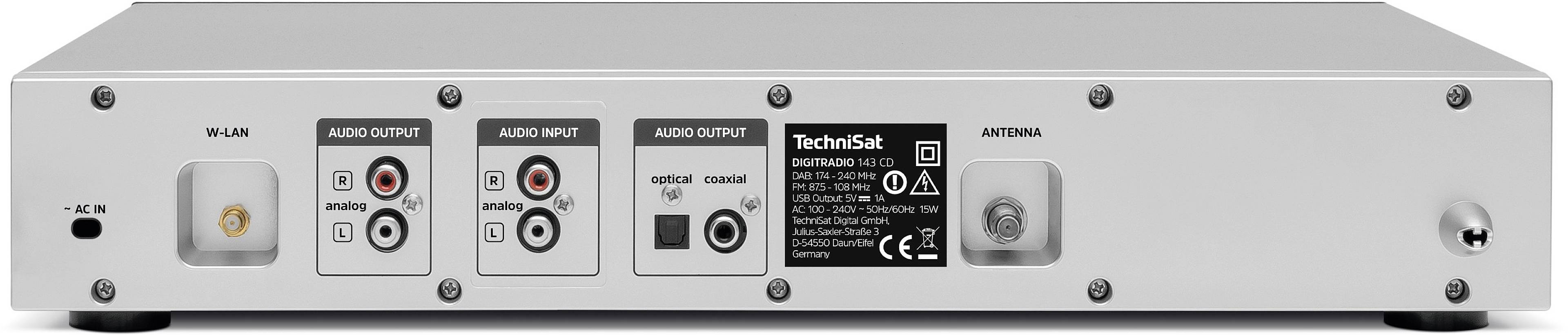 Zadní pohled na elektronické zařízení s různými audio vstupy a výstupy. Vlevo: HDMI a USB. Vpravo: Koaxiální, optický a anténní vstup.