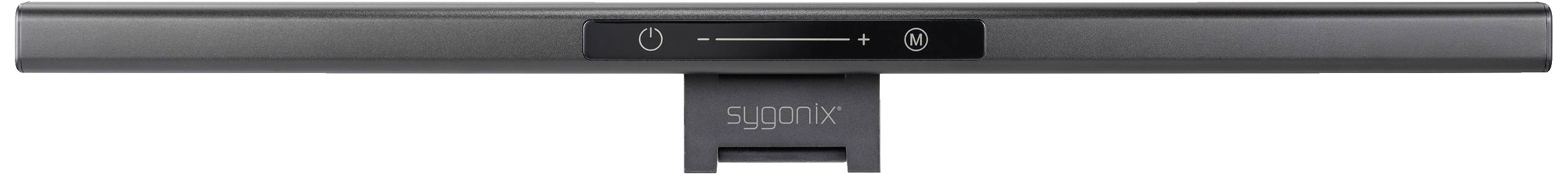 Černý soundbar s centrálním tlačítkem zapnutí/vypnutí a ovládáním hlasitosti, umístěný na podstavci.