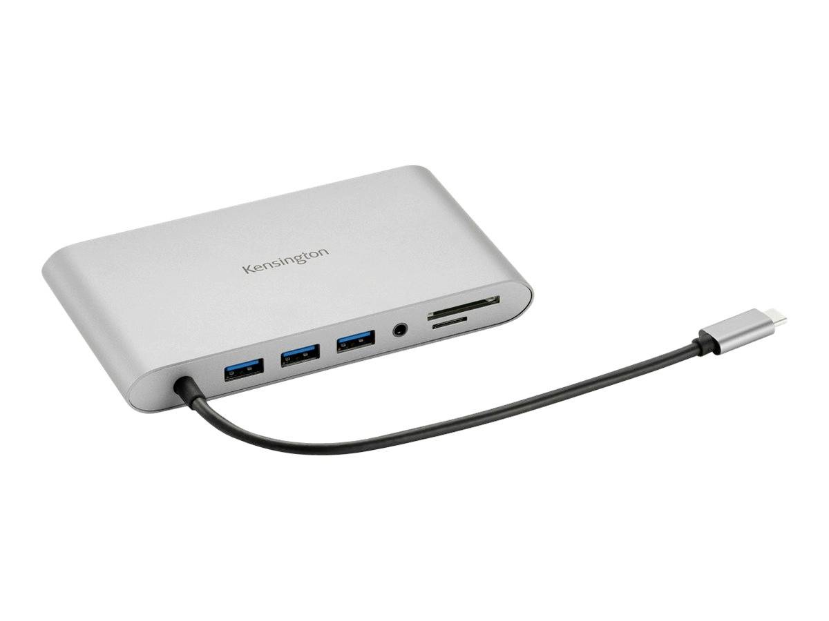 Stříbrný USB-C hub se třemi USB porty, slotem na SD kartu a připojovacím kabelem, vhodný pro rozšíření možností laptopu.