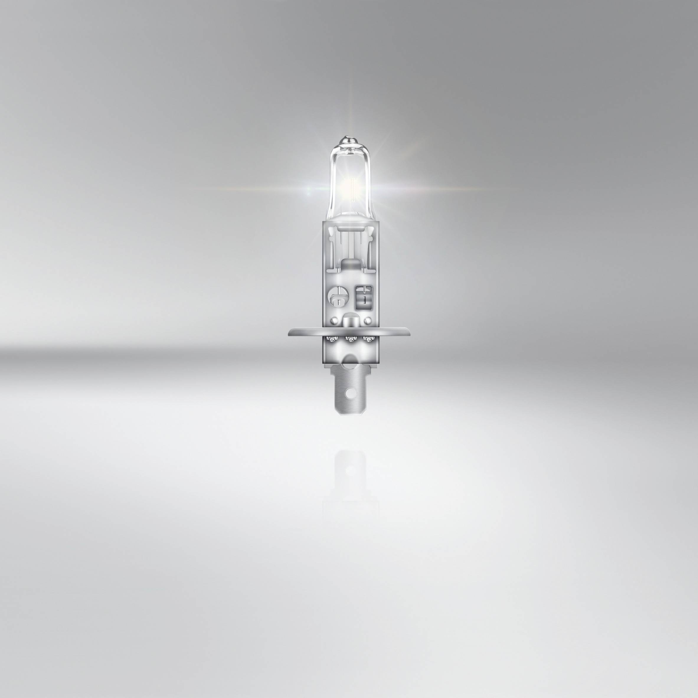 Zářivá halogenová lampa se vznáší před neutrálním pozadím a symbolizuje technologickou inovaci a osvětlení.