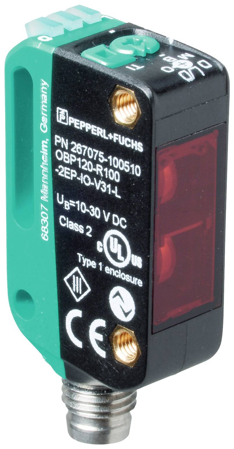 Obdélníkový optický senzor od Pepperl+Fuchs s čísly produktu a bezpečnostními štítky. Typ: OBP120-R100, napětí: 10-30V DC.