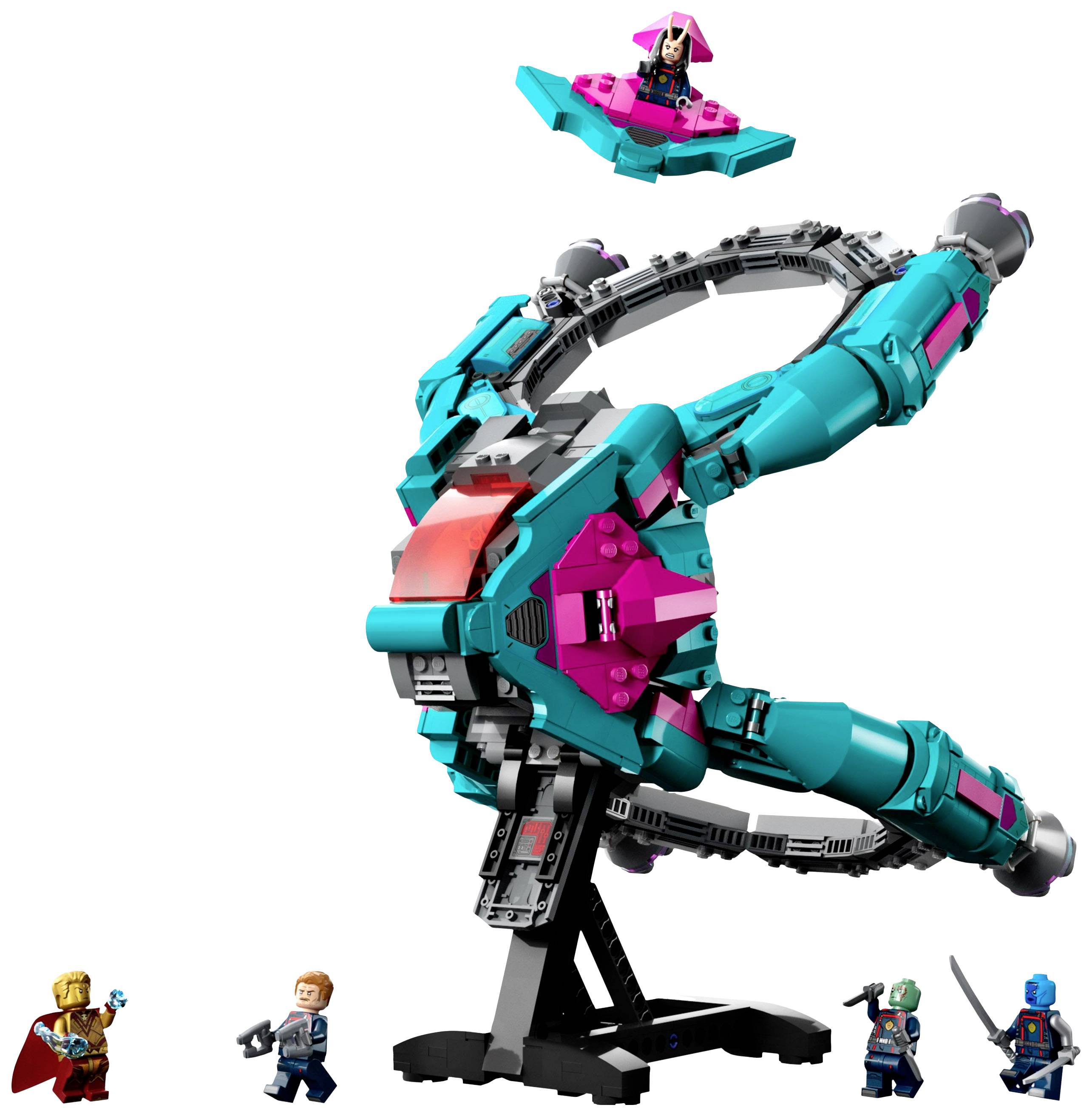 Sada Lego s tyrkysovo-růžovou, kruhovitou vesmírnou lodí a pěti minifigurkami. Jedna z figurek se vznáší na malém letadle.