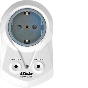 Elektronický rádiový spínač se zásuvkou, tlačítky pro 'LRN/CLR' a 'ZAP/VYP' a indikační kontrolkou na přední straně.