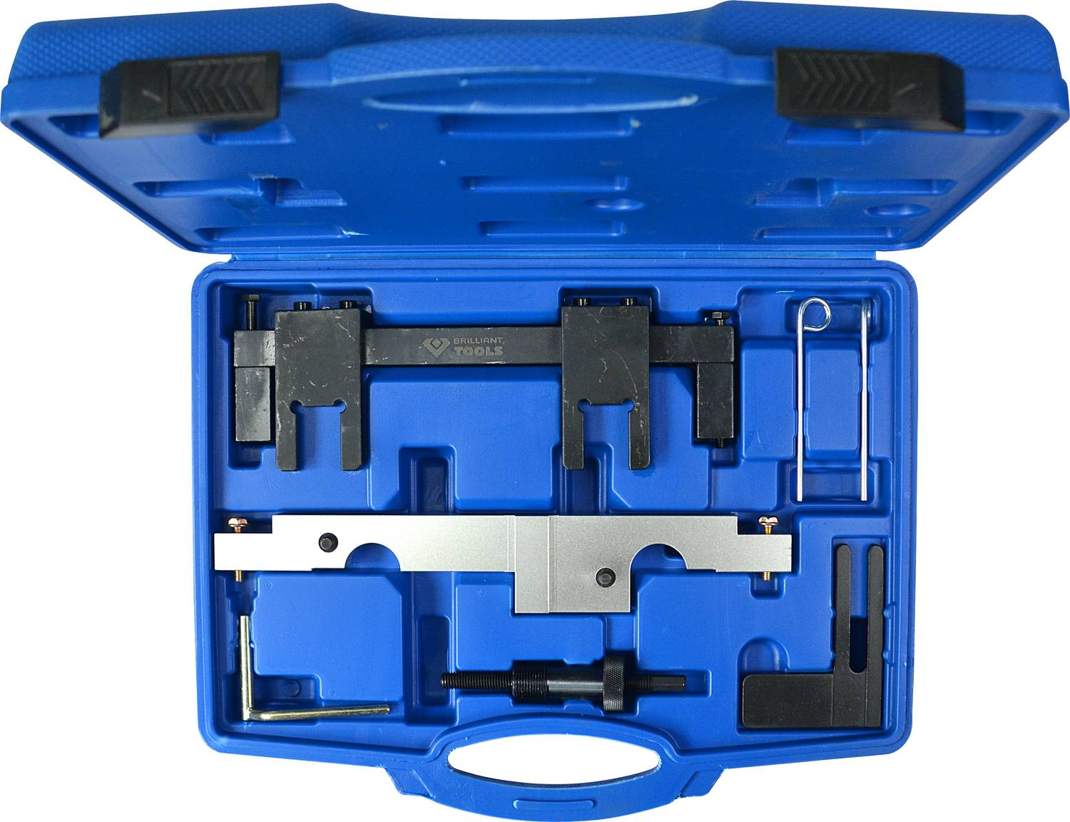 Modrý kufřík na nářadí, otevřený, ukazuje různé kovové nástroje pro nastavení motorových měřidel v přesně tvarovaných přihrádkách.
