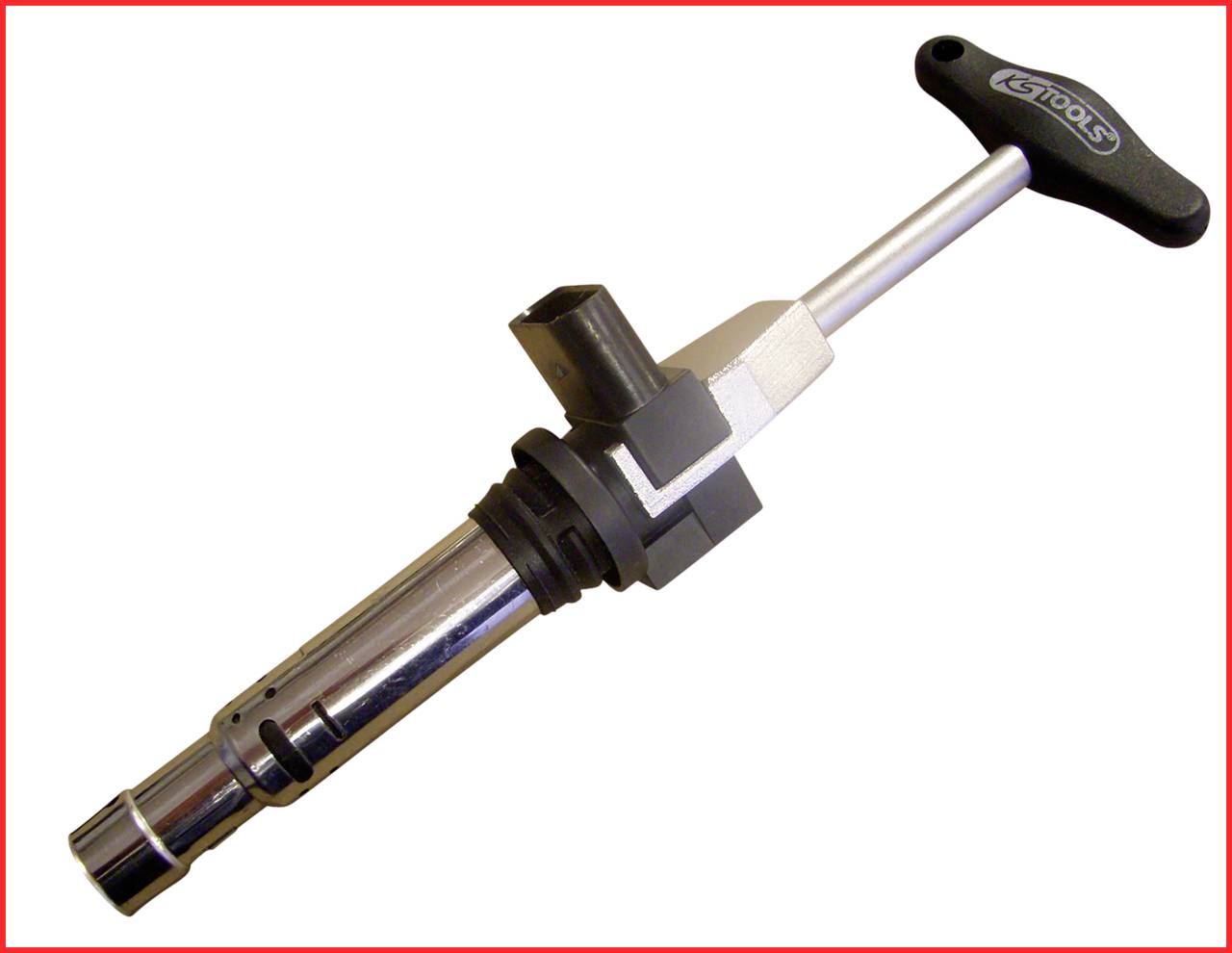 Stříbrný nástroj s T-rukojetí a válcovitou hlavou, pravděpodobně klíč na zapalovací svíčky, je zobrazen proti bílému pozadí.