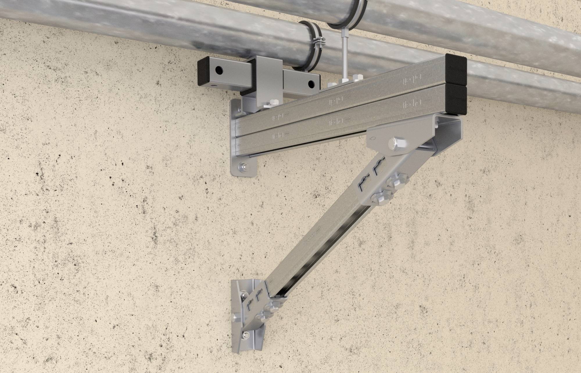 Kovový upevňovací systém namontovaný na betonové zdi, který podpírá dva paralelně vedené potrubní vedení.