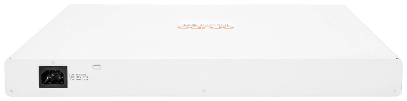 Bílý, plochý elektronický box s napájecím konektorem na levé straně. Na horní straně je oranžové firemní logo.