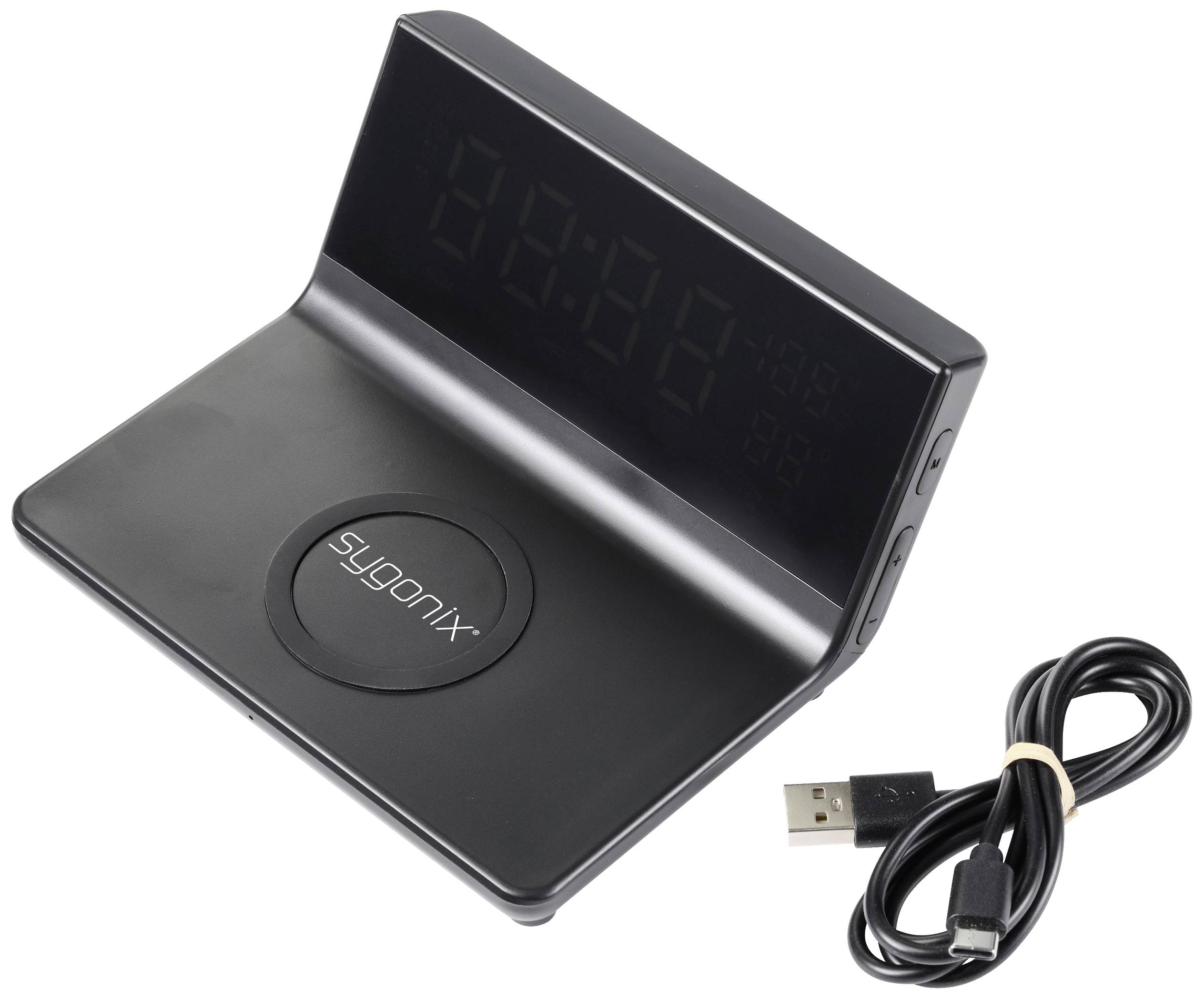 Černé elektronické zařízení s digitálním displejem a USB kabelem. Zařízení zobrazuje čas a má bezdrátovou nabíjecí funkci.