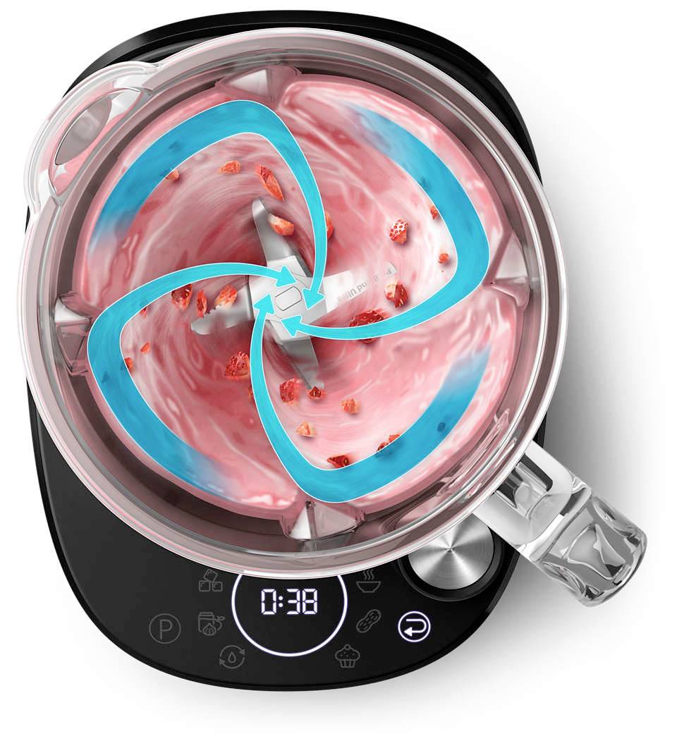Pohled shora na mixér s ovocem a růžovým smoothie. Modré šipky znázorňují rotační pohyb. Digitální displej ukazuje '0:38'.