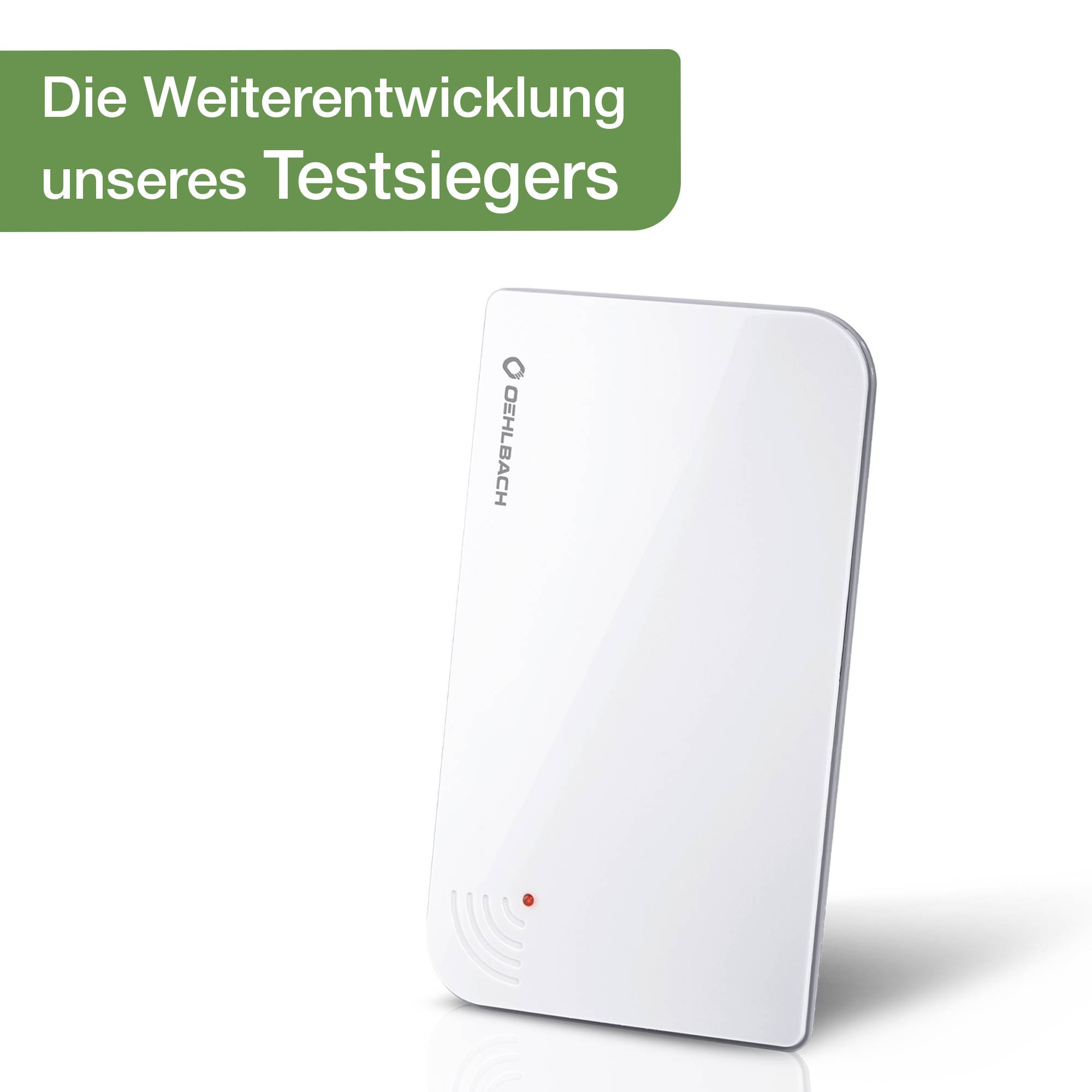 Bílé, obdélníkové zařízení Oehlbach s LED displejem; vedle zelený banner s textem 'Další vývoj našeho testového vítěze'.