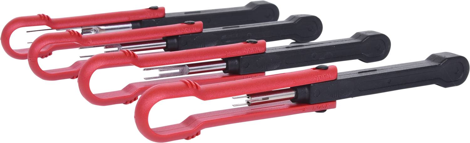 Několik červených a černých elektrických testovacích zástrček v řadě.