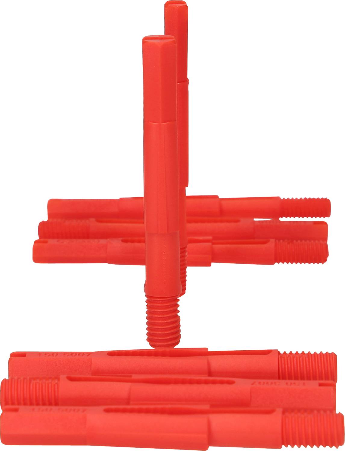 Několik červených plastových hmoždinek je naskládáno horizontálně do řad. Ukazují příklad stavebního příslušenství.