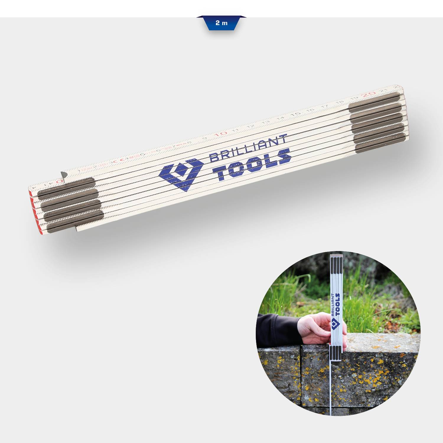 Skládací metr s nápisem 'Brilliant Tools' v bílé barvě. Kulatý obrázek ukazuje měření.