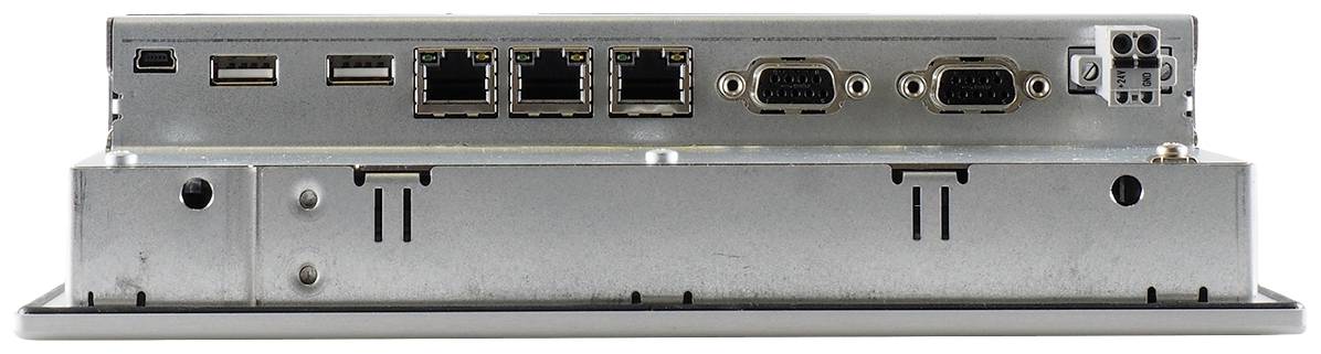Pohled zezadu na elektronické zařízení s několika ethernetovými a USB porty, dvěma sériovými porty a spínačem.