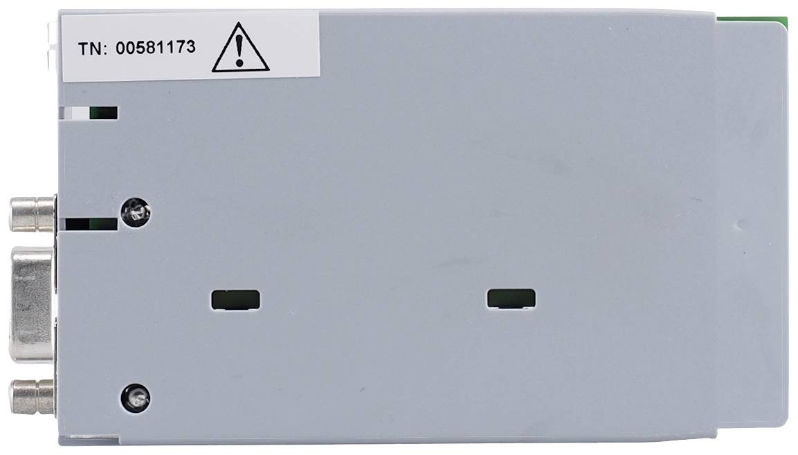 Šedý elektronický kryt s výstražným symbolem a číslem '00581173'. Po levé straně jsou umístěny připojovací zásuvky.