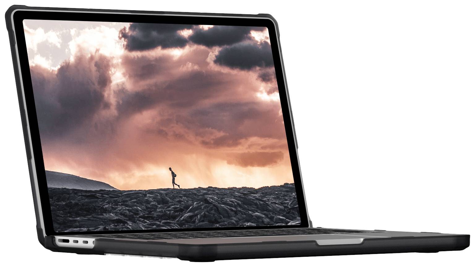 Otevřený laptop zobrazuje displej s dramatickým západem slunce a malou postavou běžící v rozlehlé krajině.