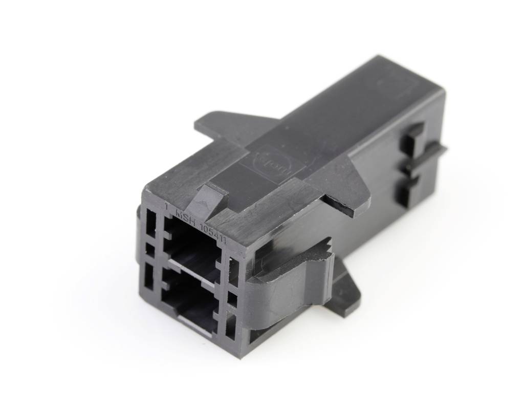 Černý plastový konektor s více připojovacími body v obdélníkovém tvaru, vhodný pro elektronická propojení.