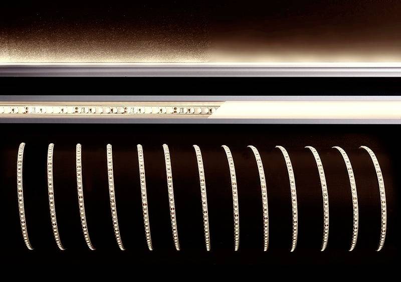 LED světelné pásky v elegantním, moderním designu, uspořádané v pravidelných vlnách na tmavém pozadí.