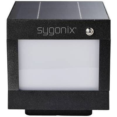 Černá, čtvercová solární lampa Sygonix se spínačem v pravém horním rohu, která svítí za tmy.