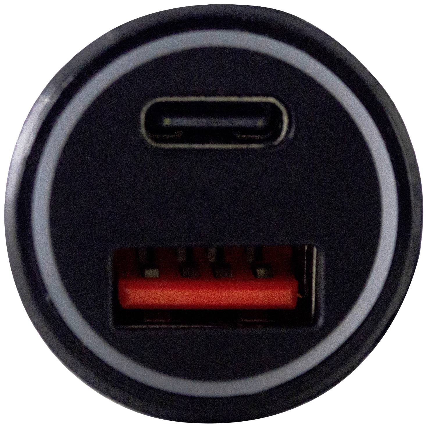 Dva USB porty (USB-C nahoře, USB-A dole) na kulatém černém povrchu.