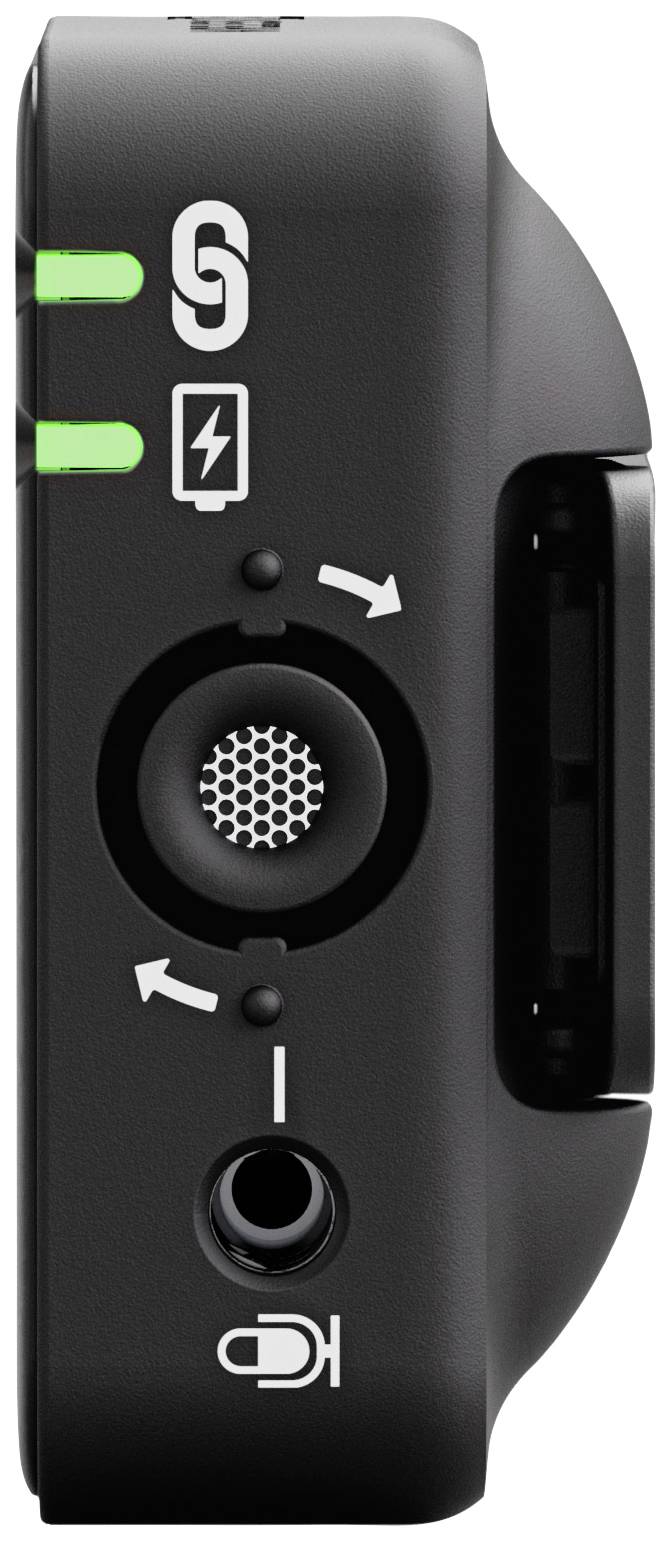 Černé zařízení s nabíjecím portem, symbolem Bluetooth a vstupem pro sluchátka. Dvě zelené kontrolky indikují stav.