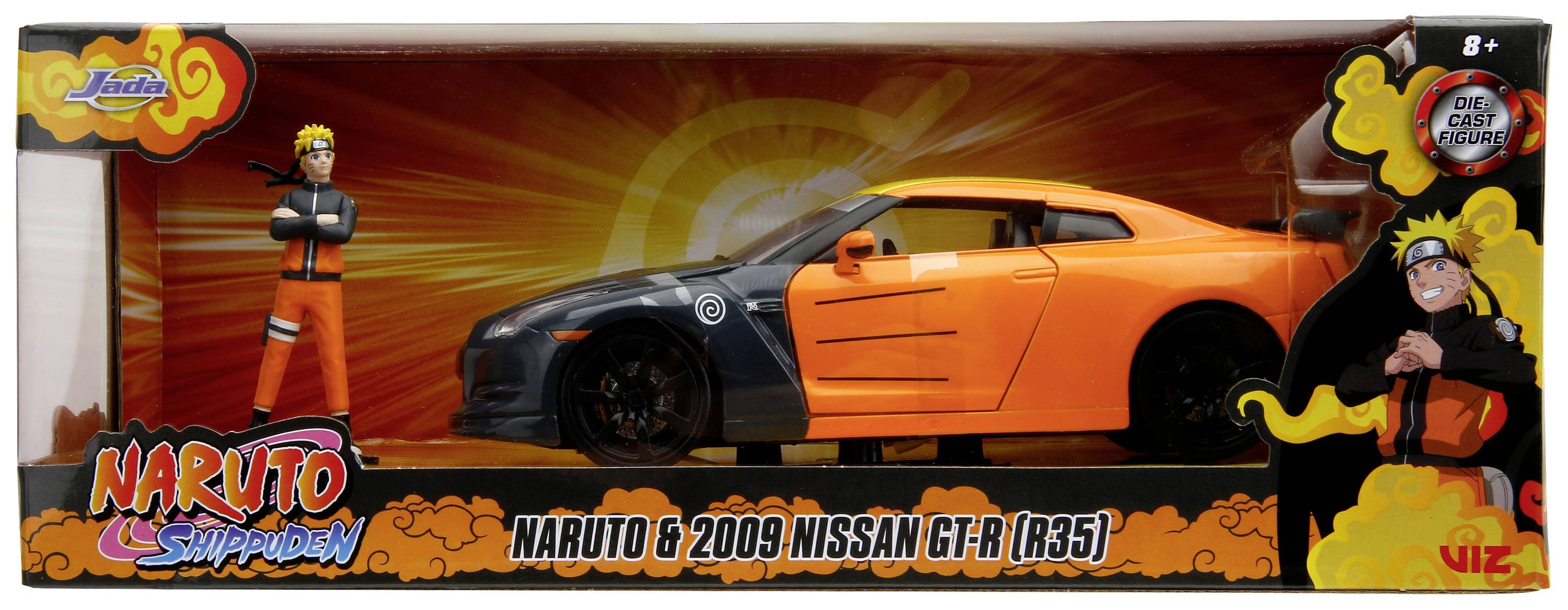 Hračkové auto v oranžovo-černé barvě v krabici, inspirované seriálem 'Naruto Shippuden'. Obsahuje figurku postavy v oranžovém oblečení.