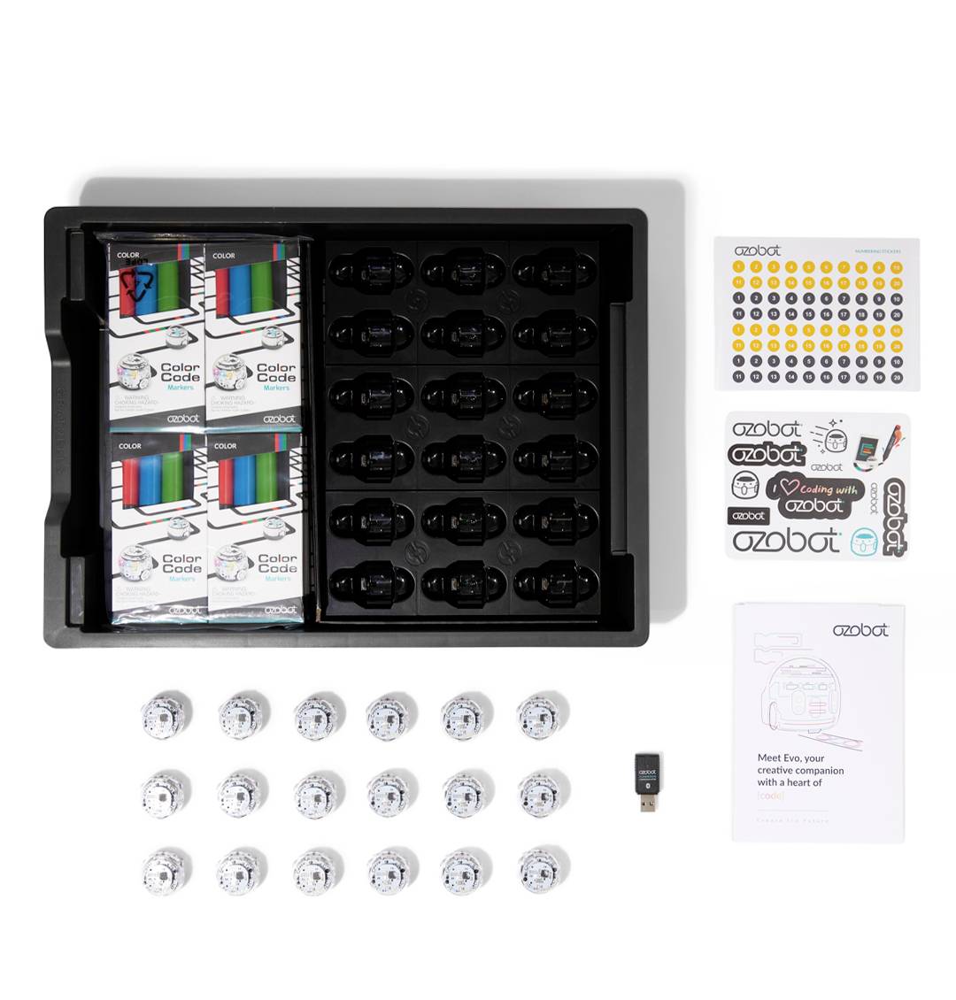 Sada robotů Ozobot v krabici s barevnými kódy, samolepkami a návodem. Ideální pro vzdělávací účely a programování.