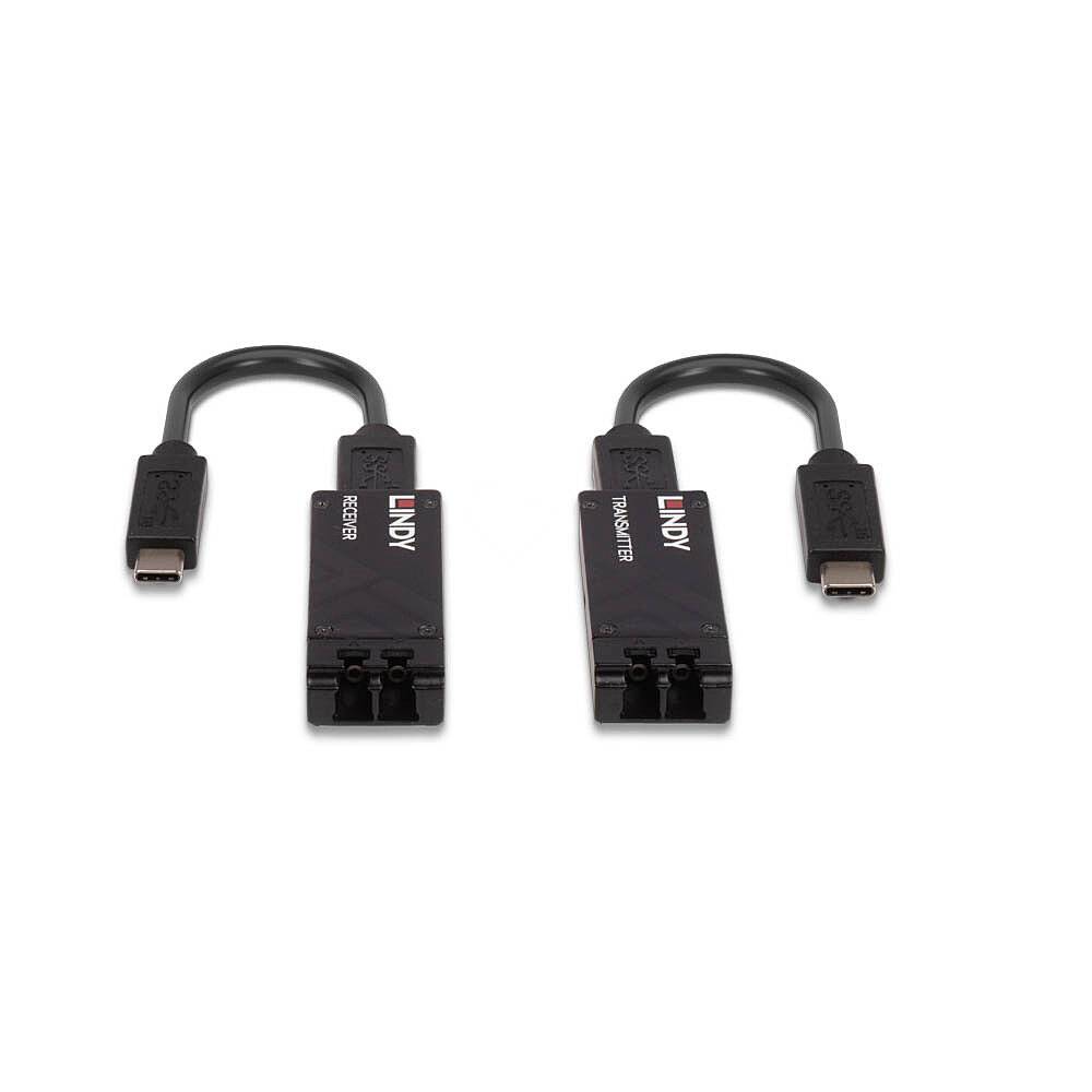 Dva černé adaptéry s USB-C konektorem a optickými vstupy. Vlevo nápis 'RECEIVER', vpravo nápis 'TRANSMITTER', oba s logem LINDY.